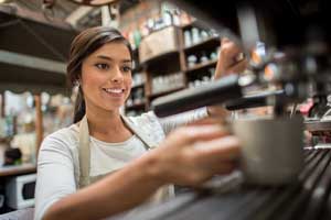 girl-making-espresso smiling barista